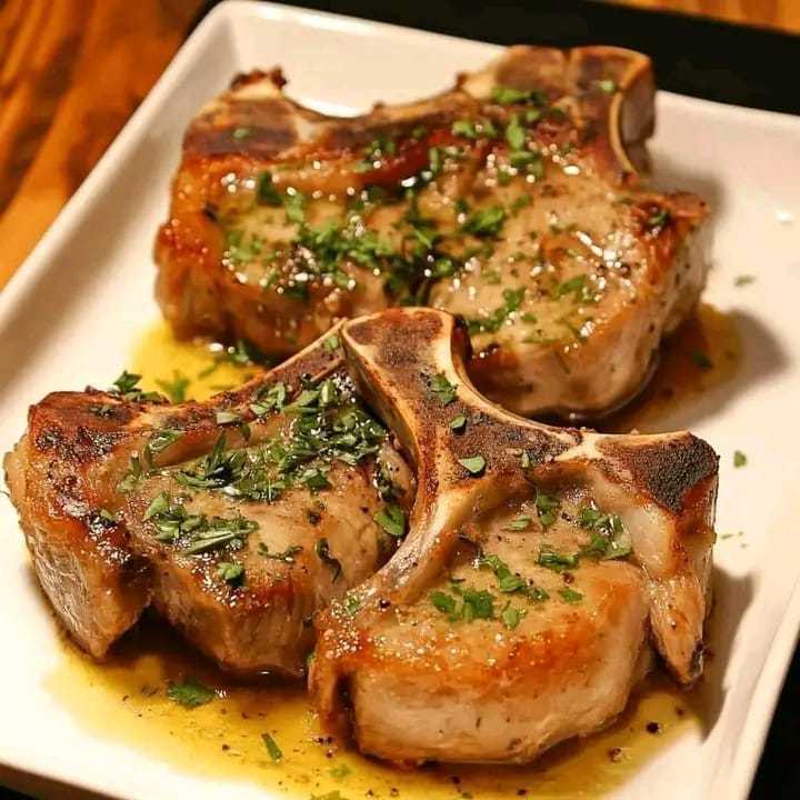 Herb-Crusted Pork Chops with Garlic Butter Sauce